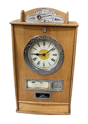 Lot 327 - BRYANS 'THE CLOCK'; a coin operated oak cased...