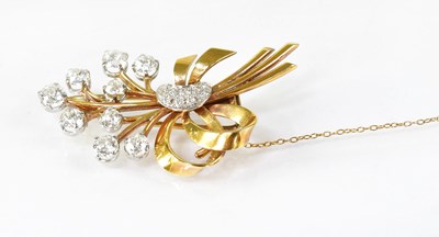 Lot 872 - A yellow metal and diamond spray brooch, the...