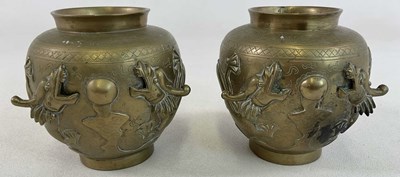 Lot 366 - A pair of Oriental brass vases, with moulded...