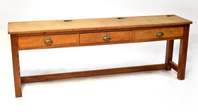 Lot 67 - A vintage triple school desk with cut-outs for...