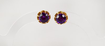 Lot 917 - A pair of yellow metal claw mounted amethyst...