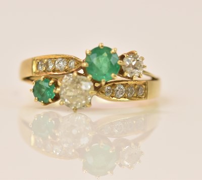 Lot 591 - An 18ct yellow gold emerald and diamond ring...