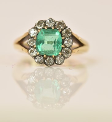 Lot 586 - An 18ct yellow gold emerald and diamond...