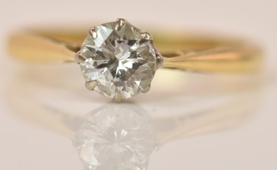 Lot 607 - A yellow metal diamond solitaire ring, the...