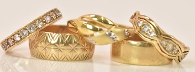 Lot 602 - Four 9ct yellow gold rings including an...