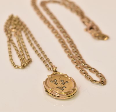 Lot 595 - A 9ct gold back and front oval locket...