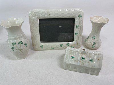 Lot 298 - BELLEEK; a photo frame, two vases and Dan...