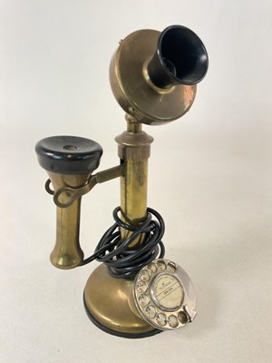 Lot 56 - A brass candlestick telephone celebrating the...