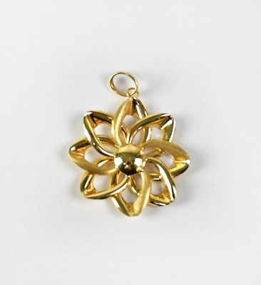 Lot 879 - A 14ct yellow gold flower head pendant, length...