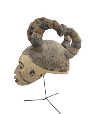 Lot 1045 - An African carved wooden Igbo maiden mask, on...
