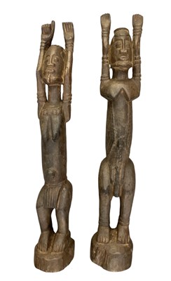 Lot 698 - Two carved wooden Dogon Tellem figures, male...