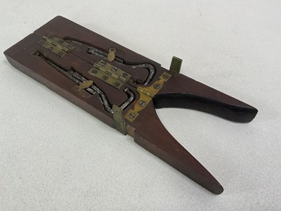 Lot 113 - A Campaign boot jack, includes lace pullers...