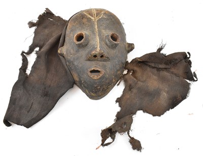 Lot 359 - TRIBAL ART; an African mask, probably Dan...