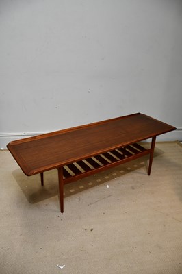 Lot 53 - A mid century teak two tier long drum coffee...