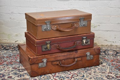 Lot 1303 - Three vintage suitcases including two leather...