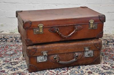 Lot 1304 - Two vintage leather suitcases, one example...