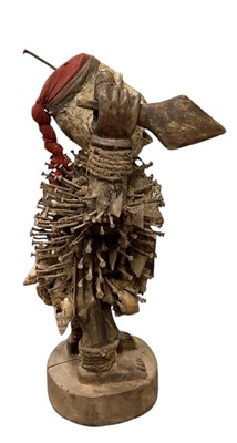Lot 1073 - An African carved wooden Nkisi nail fetish...