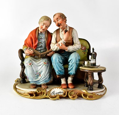 Lot 197 - CAPODIMONTE; a figure group of a couple on a...