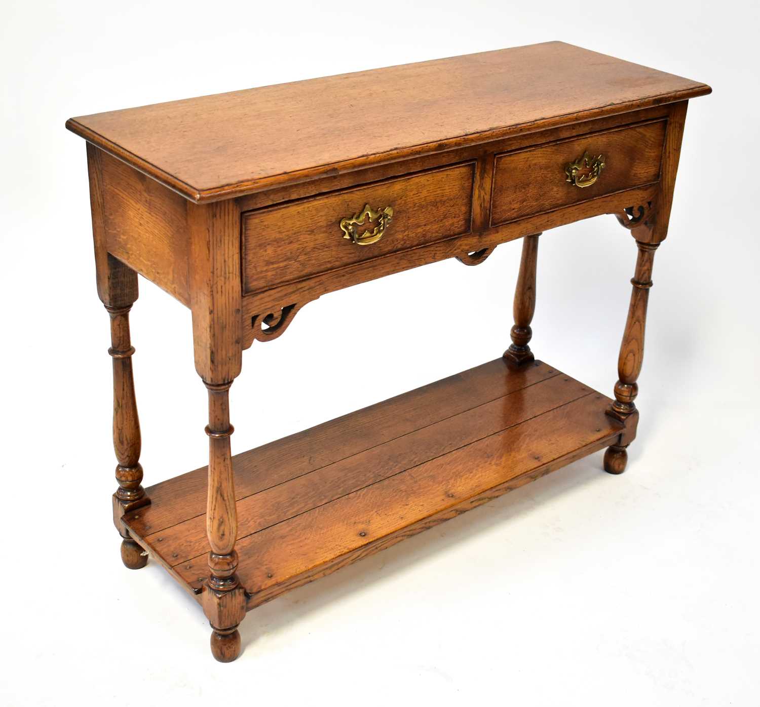 Lot 90 A reproduction oak side table in the manner