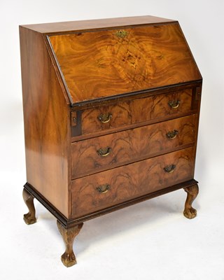 Lot 32 - A mid-20th century burr walnut bureau, fall...