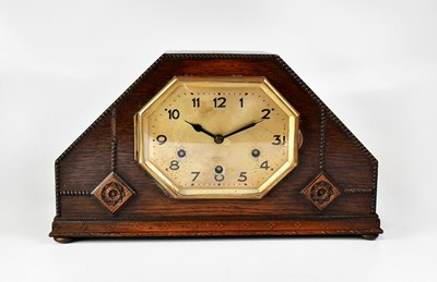 Lot 162 - An early 20th century oak cased mantel clock...