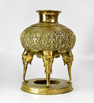 Lot 567 - An Indian brass pot with embossed decoration...