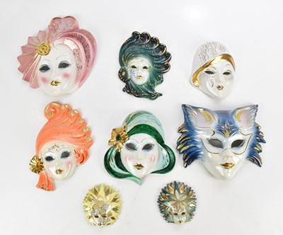 Lot 579 - A collection of eight ceramic decorative masks,...