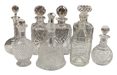 Lot 590 - Eight cut and crystal glass decanters, height...
