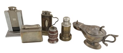 Lot 363 - A collection of six novelty table lighters...