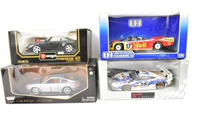 Lot 664 - Four 1:18 scale collectors' diecast model cars...