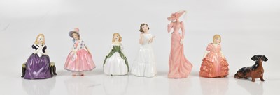 Lot 484 - ROYAL DOULTON; a group of five Doulton figures...