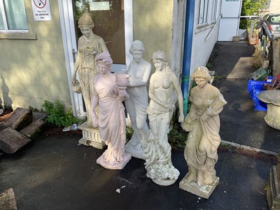 Lot 258 - A group of four fibreglass statues in the...