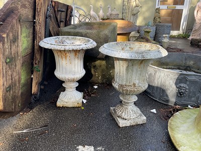 Lot 269 - A pair of white painted cast iron urns, height...