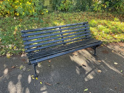 Lot 260 - A black painted iron framed garden bench,...