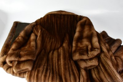 Lot 385 - A full-length mink coat, with wide collar and...