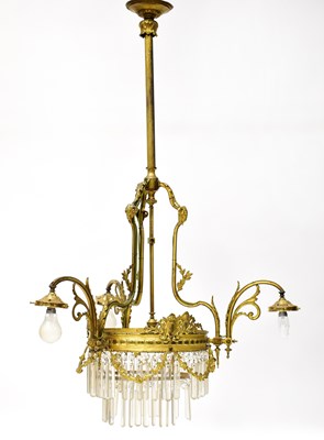 Lot 86 - A gilt brass and cut glass three-branch...