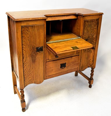 Lot 24 - An early 20th century oak side-by-side bureau,...