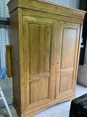 Lot 785 - A modern light oak large wardrobe with...