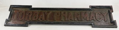 Lot 2 - TORBAY PHARMACY: a hammered copper shop front...