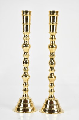 Lot 1343 - A large pair of decorative brass bobbin form...