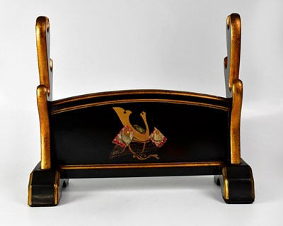 Lot 438 - A black lacquered and gold speckled triple...