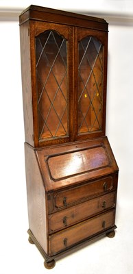 Lot 73 - An oak bureau bookcase, 202 x 74 x 41cm.