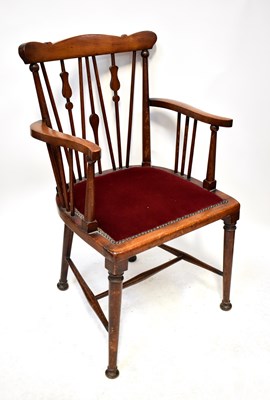 Lot 126 - An Arts and Crafts style armchair with reed...