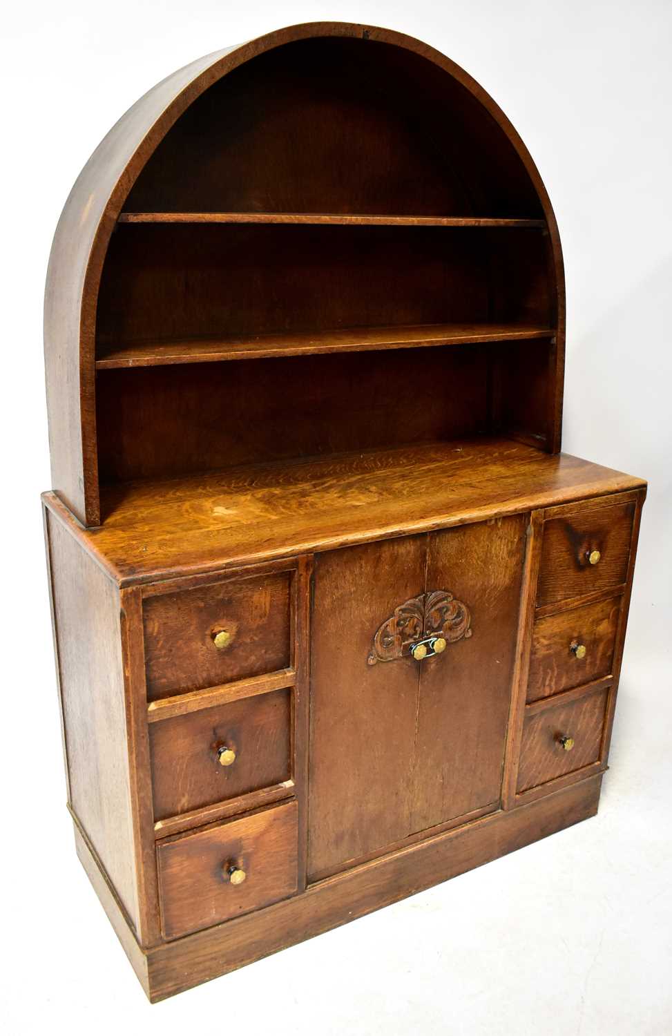 Lot 9 - A 1930s oak dresser with two-shelf domed top,...