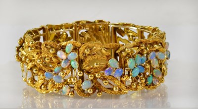 Lot 856 - A c.1960s 18ct yellow gold floral bracelet set...