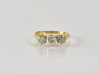 Lot 822 - An 18ct yellow gold three-stone diamond ring,...