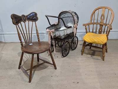 Lot 963 - A vintage wicker doll's pram, with two child's...