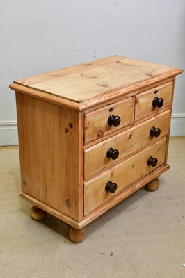 Lot 235 - An old pine chest of two short over two long...