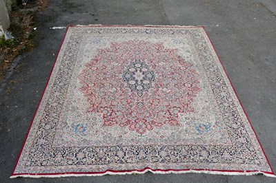 Lot 297 - A large hand knotted woollen carpet, with...