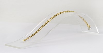 Lot 865 - A 9ct yellow gold figaro chain link bracelet,...